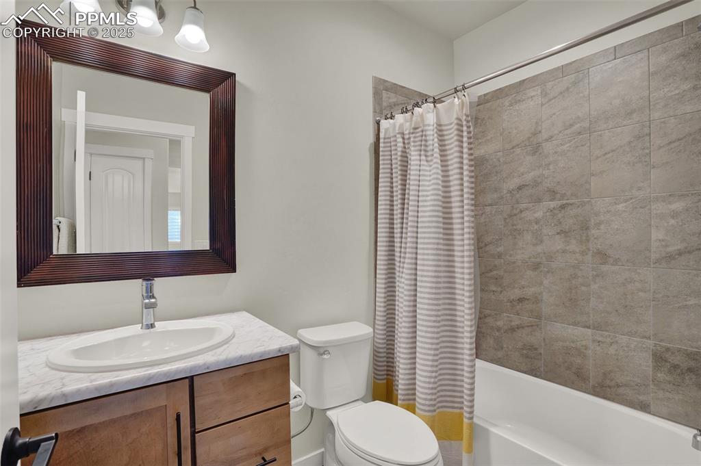 Image 36 of 42: Lower level full bathroom.