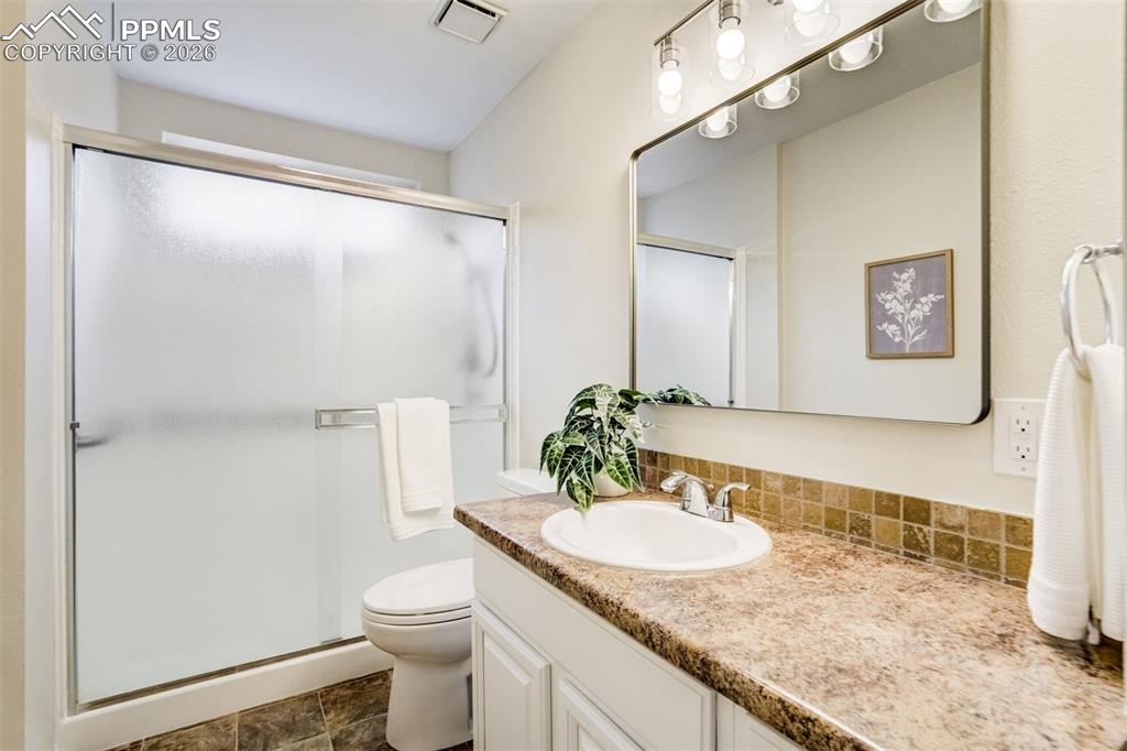 Image 11 of 43: Updated mirror and light fixture