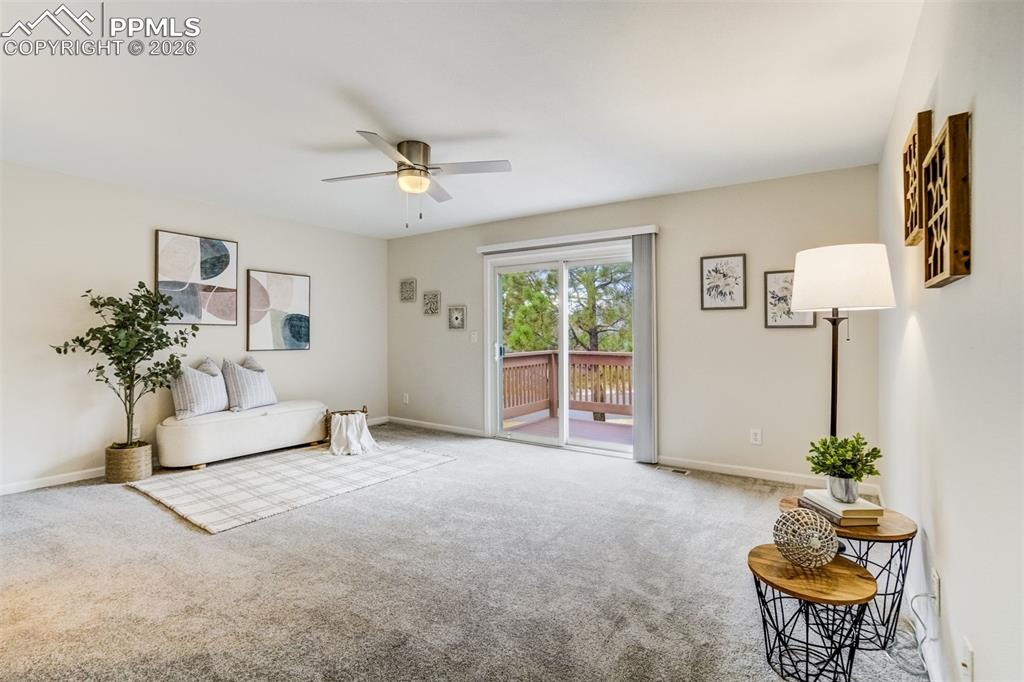 Image 18 of 43: Generous primary bedroom walks out to composite deck