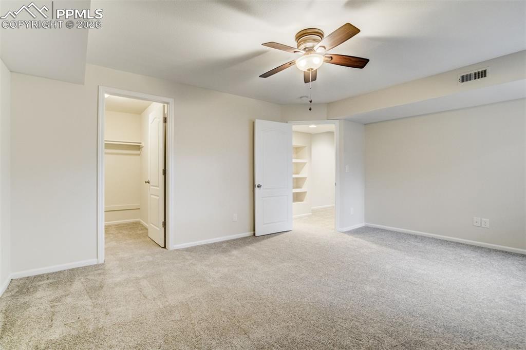 Image 31 of 43: Basement bedroom has walk in closet