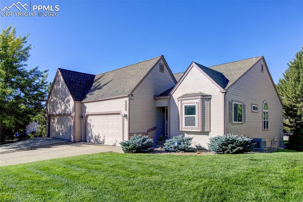 Image 37 of 43: Lovely manicured front yard