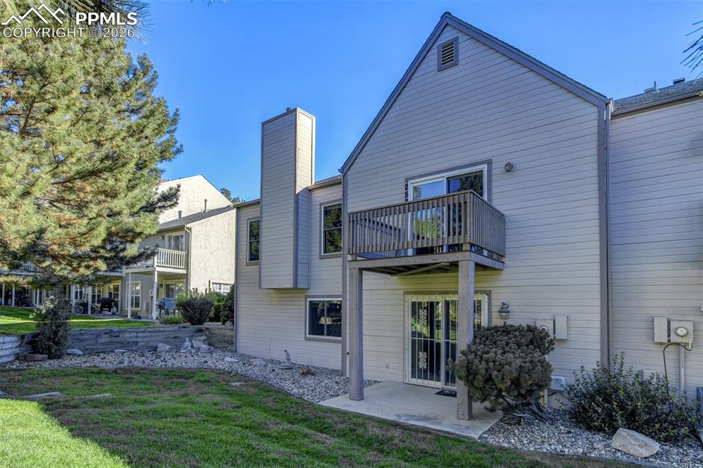 Image 40 of 43: View of back deck and patio.  Deck has new composite boards