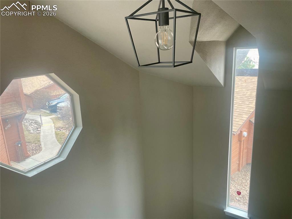 Image 11 of 43: Detailed view of light over stairs.