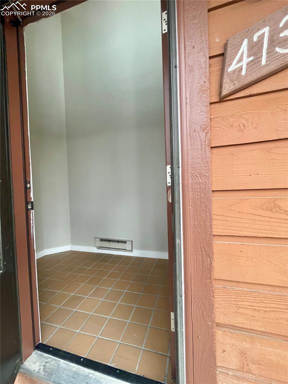 Image 2 of 43: Tile Entry has electric baseboard heat and entry court.