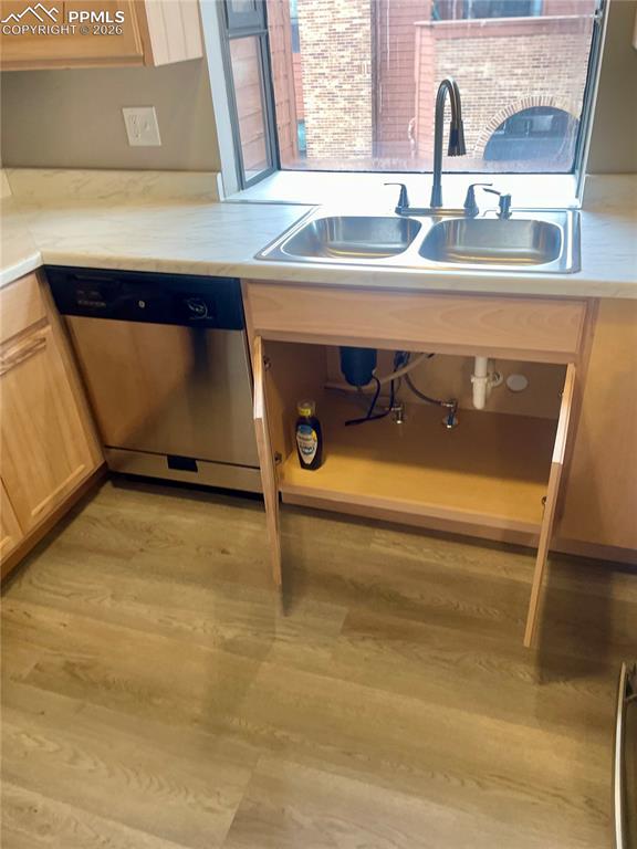 Image 20 of 43: Light countertops, Stainless dishwasher & LVP flooring