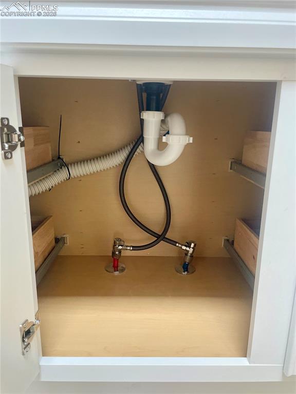 Image 28 of 43: Some new plumbing under bathroom sink.