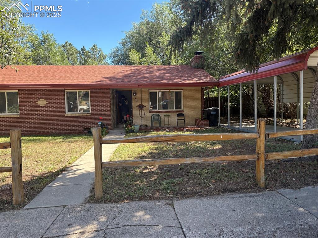 Image 2 of 11: Ranch-style home with brick siding, a chimney, roof with shingles, and craw