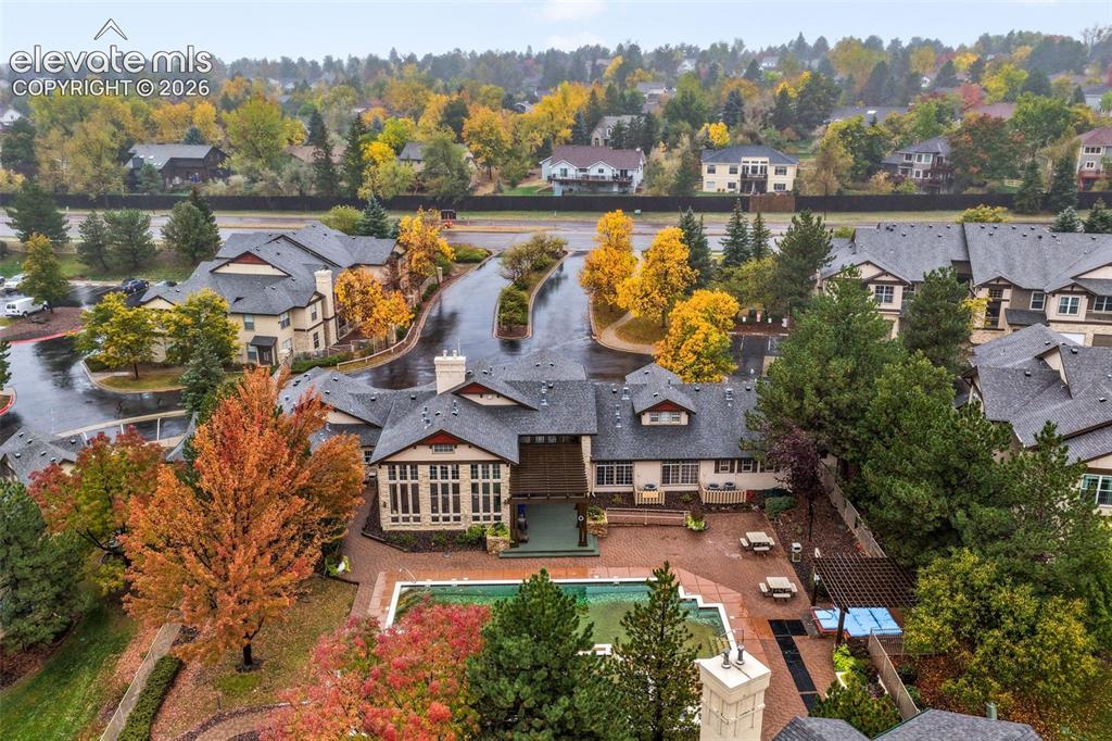 Image 45 of 50: Aerial perspective of a multi-structure property featuring an inground swim