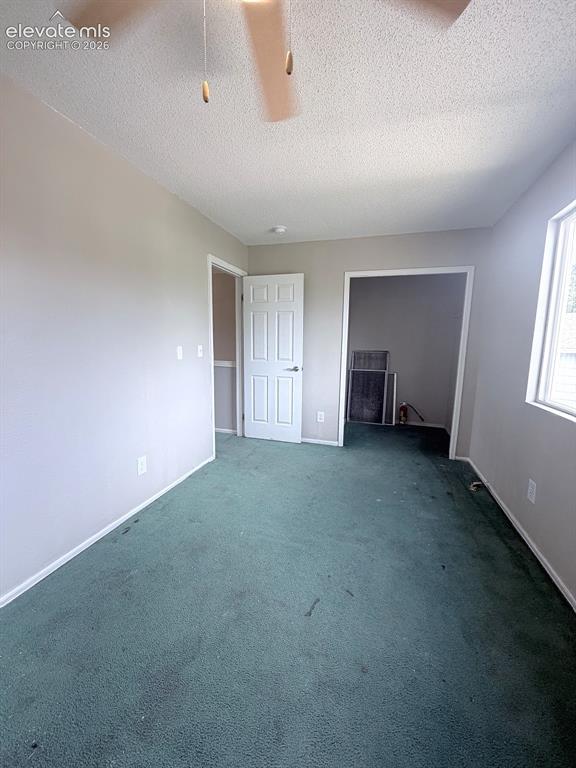 Image 12 of 14: Ceiling fan with integrated lighting, wall-to-wall carpeting, window for na