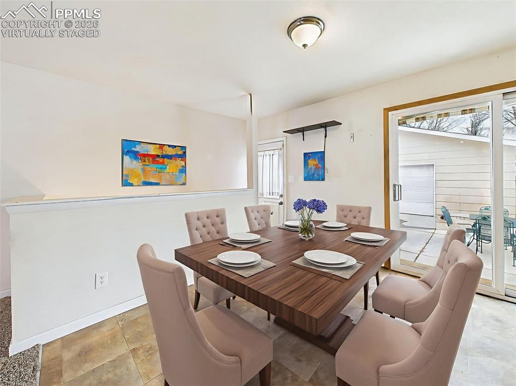 Image 11 of 50: Virtually Staged Elegant dining space with room for a large table, perfectl