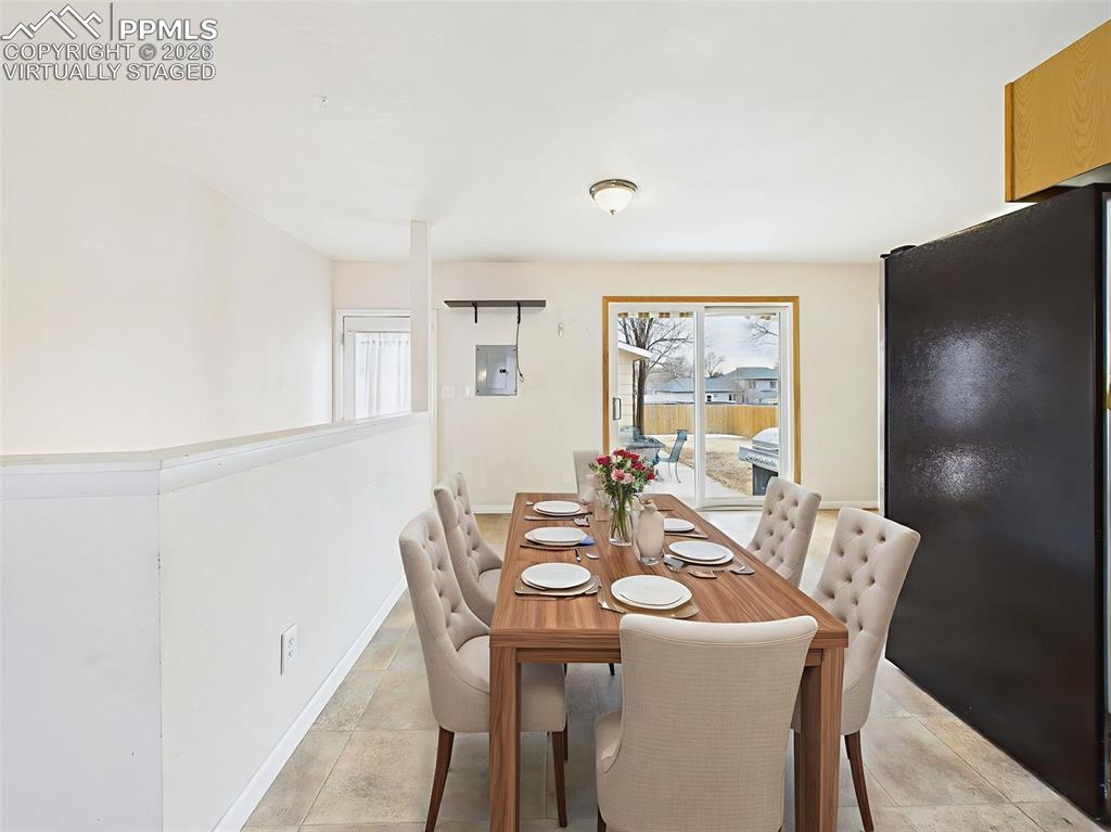 Image 15 of 50: Virtually Staged A dining area just off the kitchen is perfectly staged for