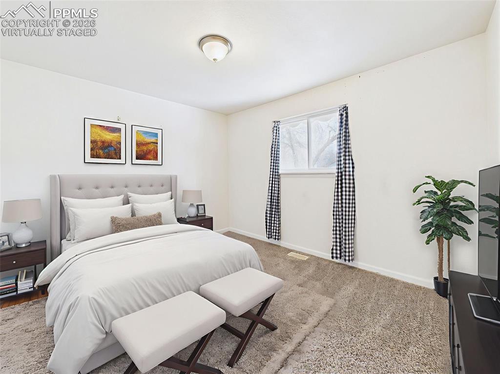 Image 22 of 50: Virtually Staged Bedroom 2 A cozy secondary bedroom with soft textures and 