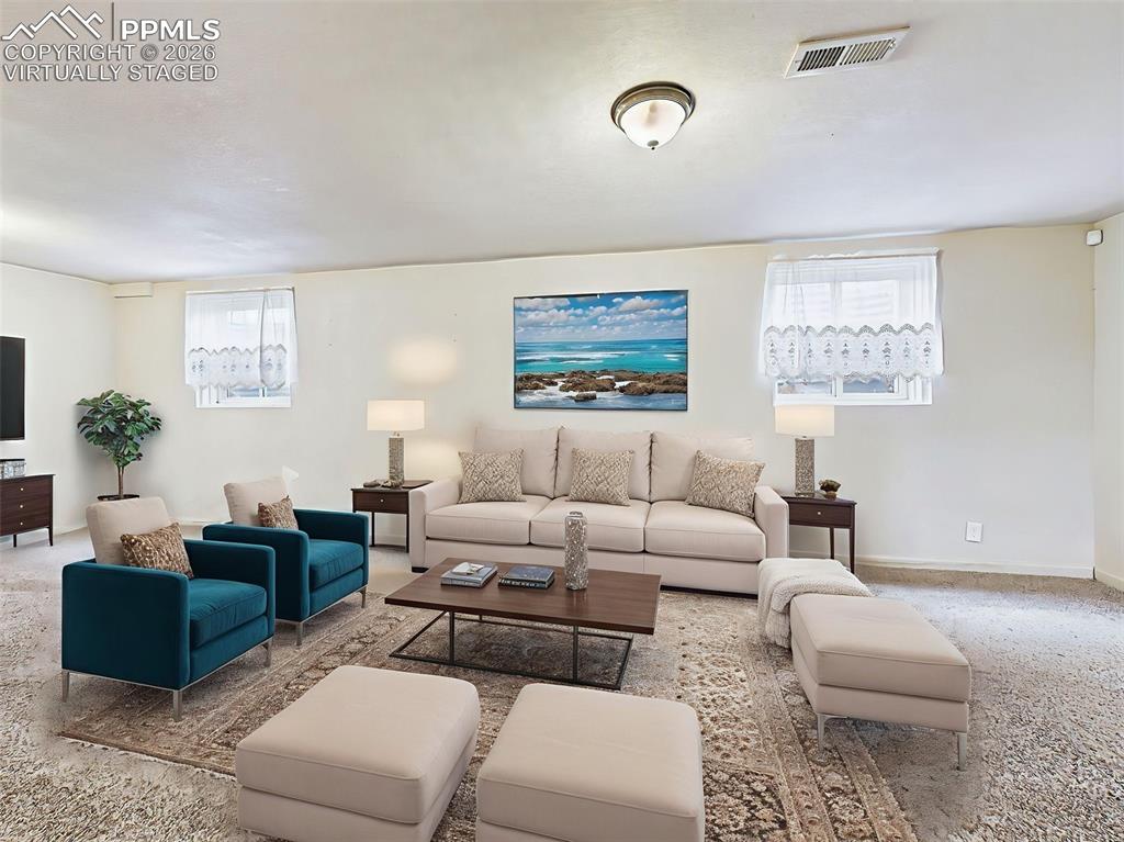 Image 29 of 50: Virtually Staged Spacious lower-level living area styled for entertaining, 