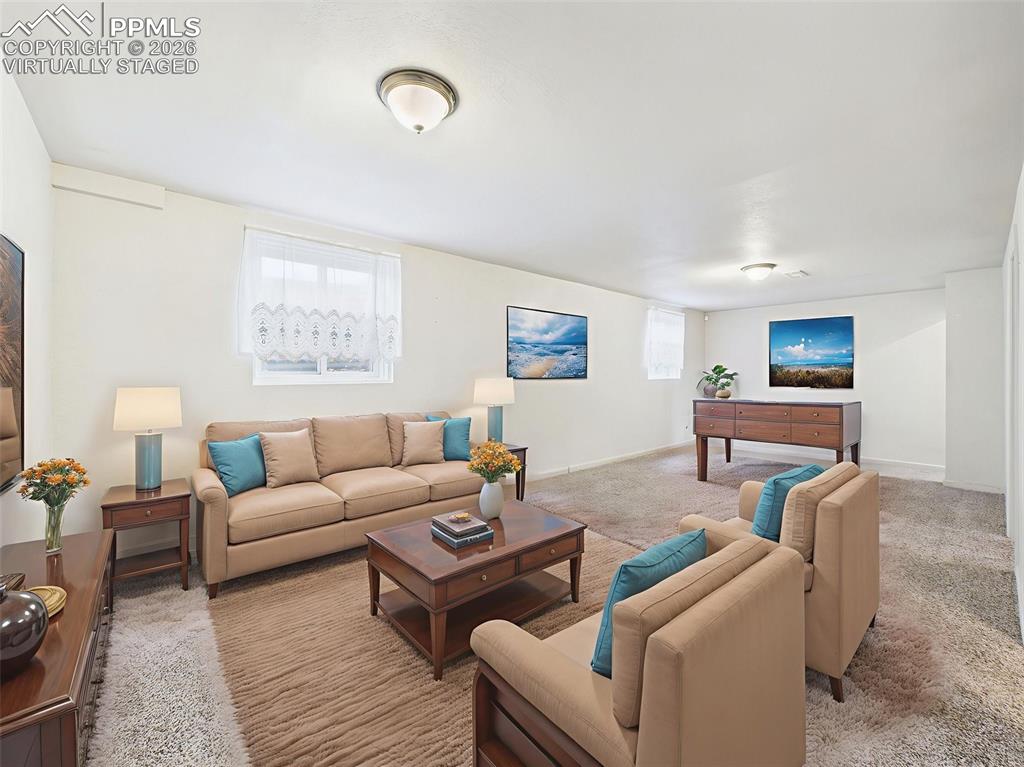 Image 33 of 50: Virtually Staged to showcase its full potential, this lower-level living sp