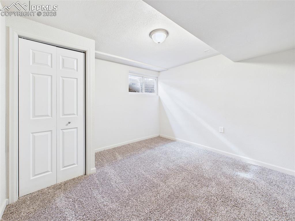 Image 36 of 50: Bedroom 5 Great light, full closet, and carpeted comfort make this room ide