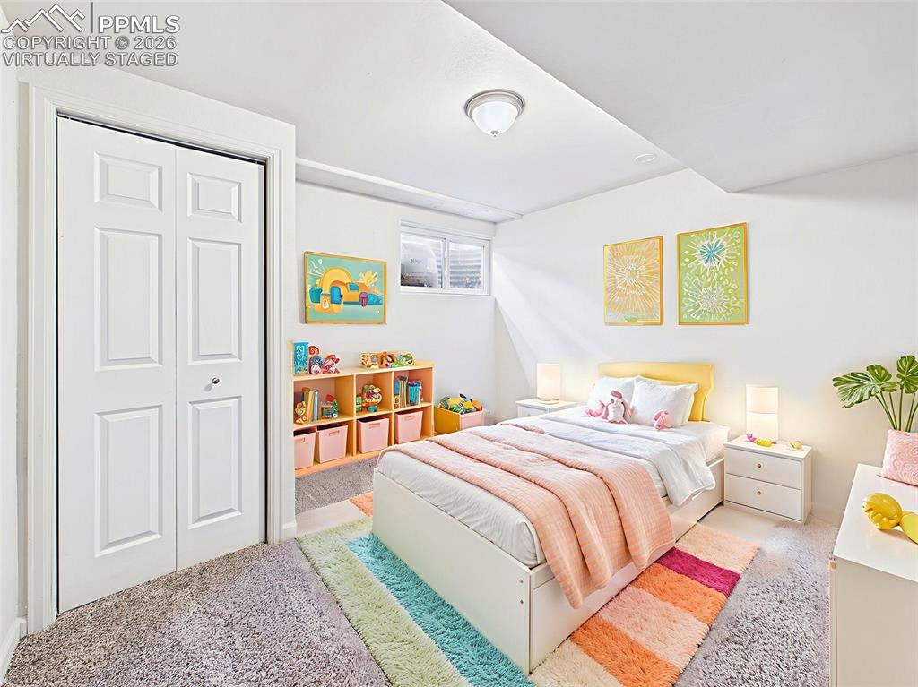 Image 37 of 50: Virtually Staged Bedroom 5 A third basement bedroom with full-size staging 