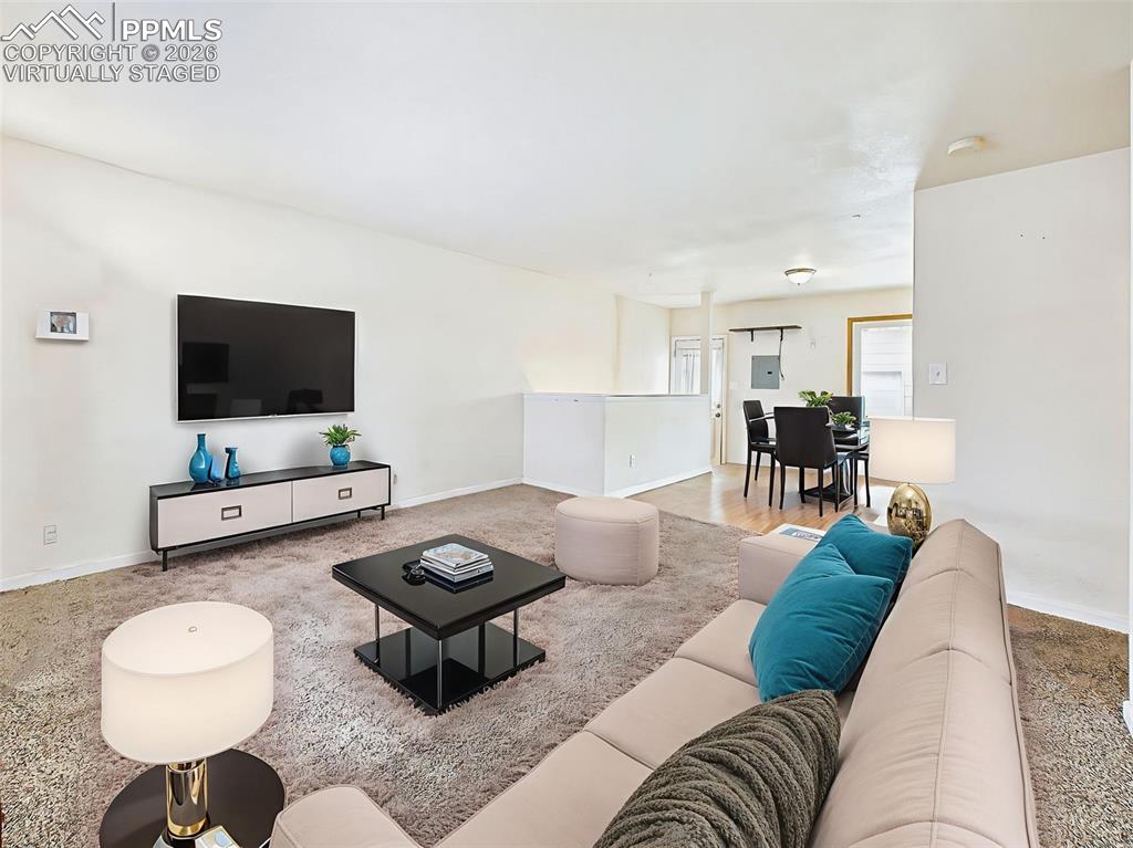 Image 4 of 50: Virtually Staged This staging layout highlights entertainment potential, wi