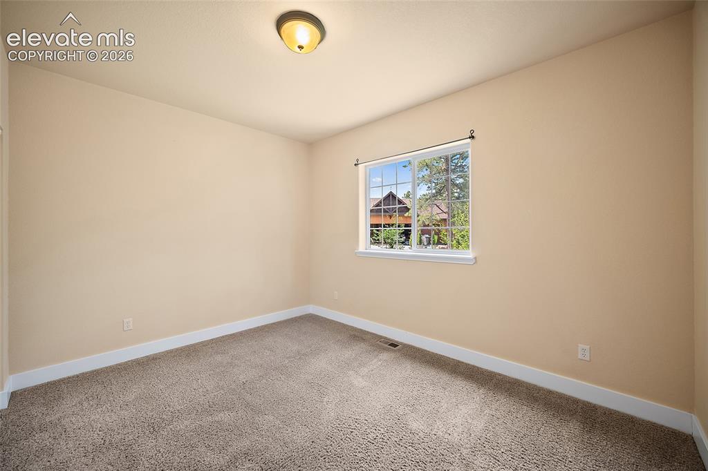 Image 41 of 50: Lower-level Bedroom