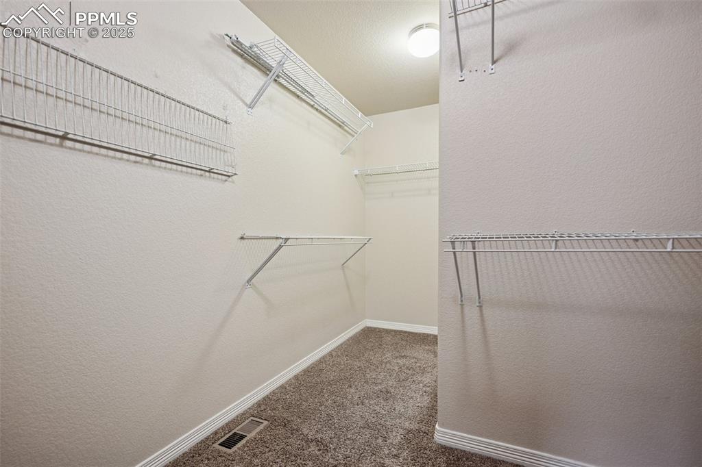 Image 18 of 48: Huge walk-in closet