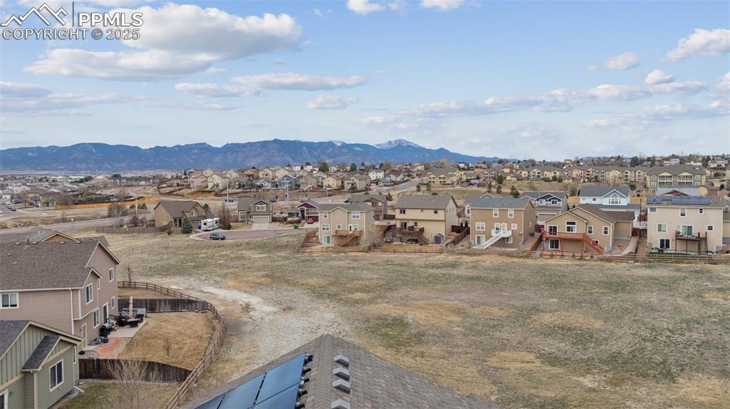 Image 35 of 48: Open space behind home will never be built on! Great views of the Front Ra