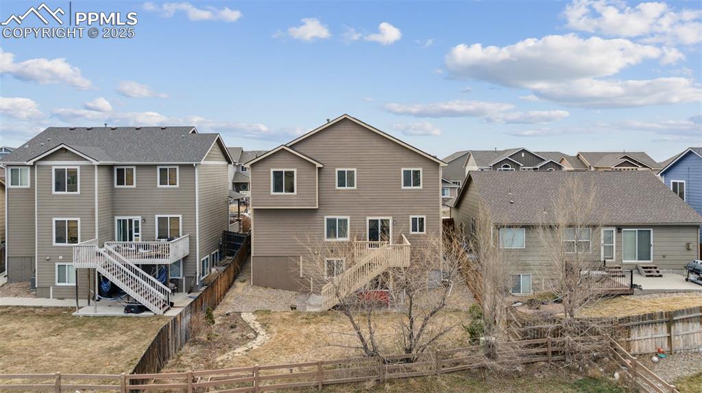 Image 37 of 48: Fully Landscaped with concrete patio below deck!