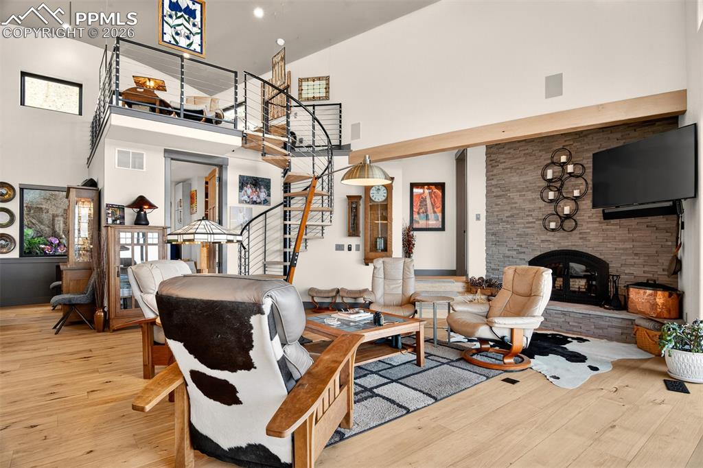 Image 11 of 50: Living room looking to the primary bedroom and the loft