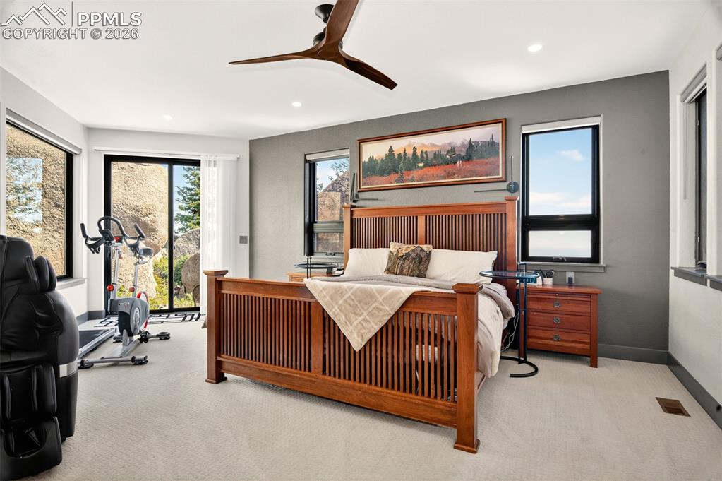 Image 29 of 50: Primary bedroom with en suite 5 piece bathroom and a walk out to private pa