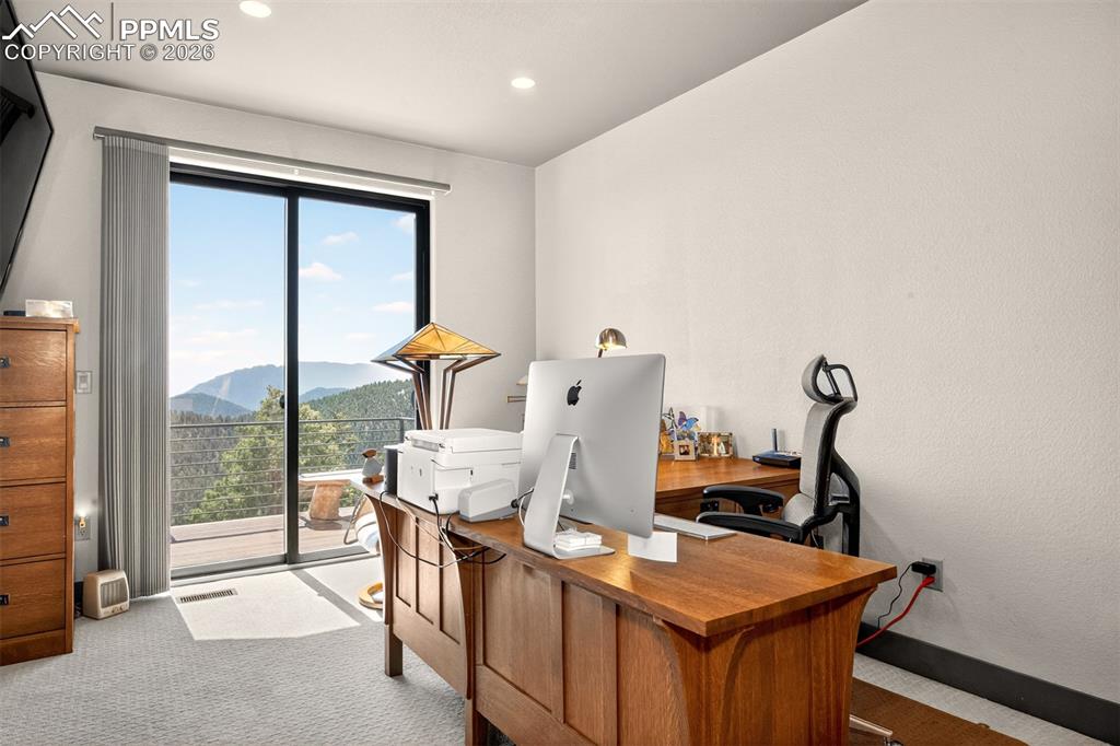 Image 37 of 50: Bedroom 4/Office with walk out to deck