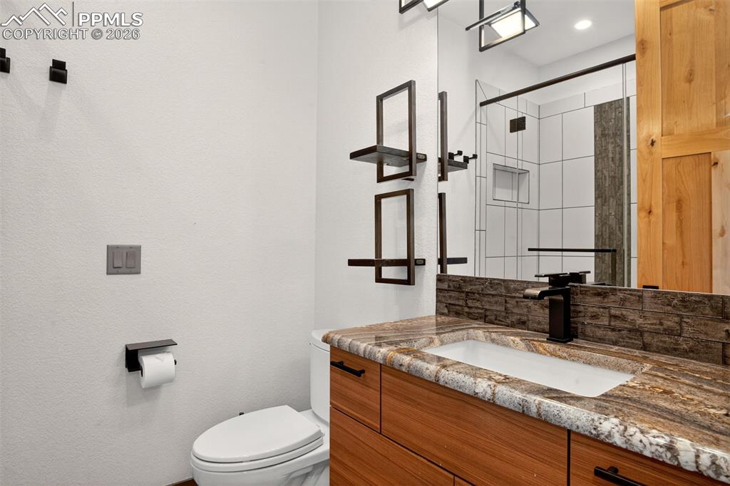 Image 41 of 50: 3/4 en suite bathroom for bedroom 2 with granite counters