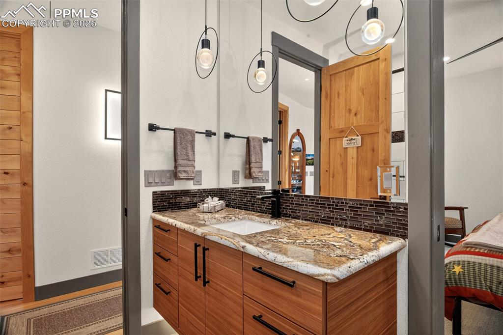 Image 45 of 50: 3/4 bathroom off bedroom 3 with access from hallway