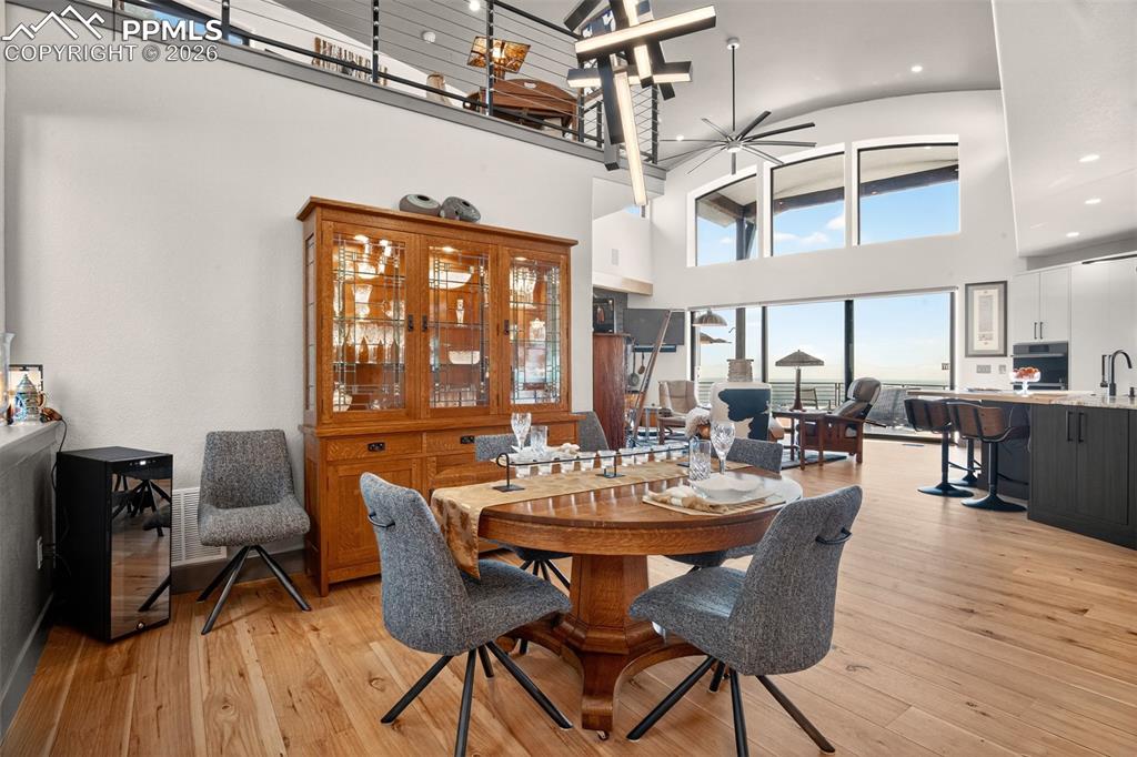 Image 7 of 50: Dining area with wood flooring 
