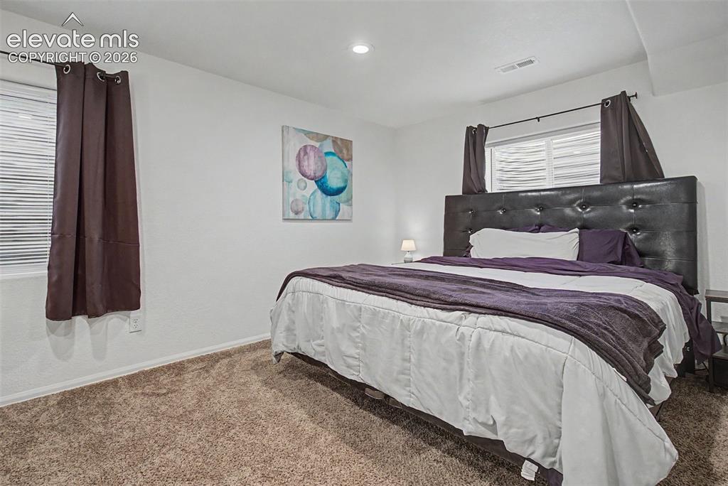 Image 27 of 39: Basement bedroom is perfect for guests