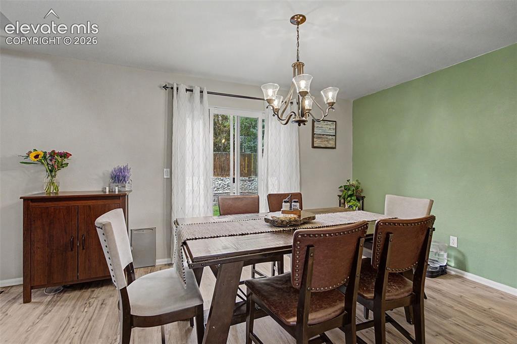 Image 8 of 39: Step from the dining room to the backyard, perfect for entertaining