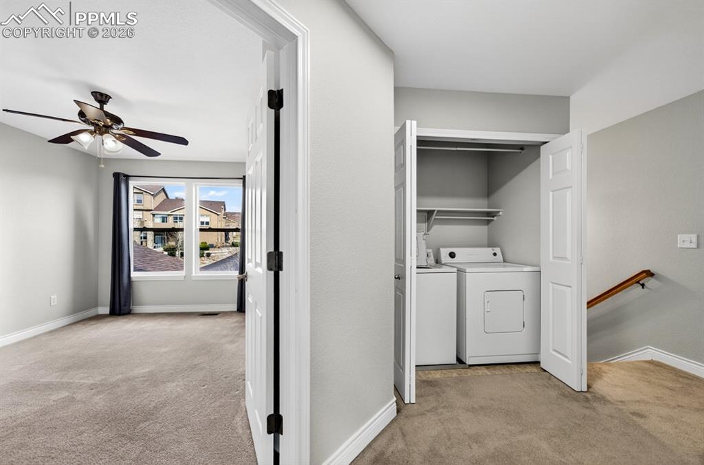 Image 13 of 21: Laundry off of primary bedroom
