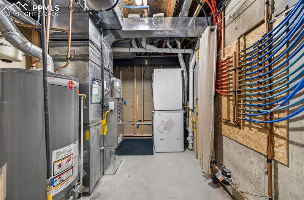 Image 18 of 21: Utility Room with Washer and Dryer in basement