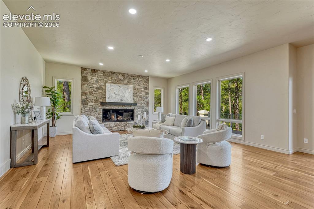 Image 4 of 48: Enjoy luxury and warmth with the new custom stone fireplace feature wall!