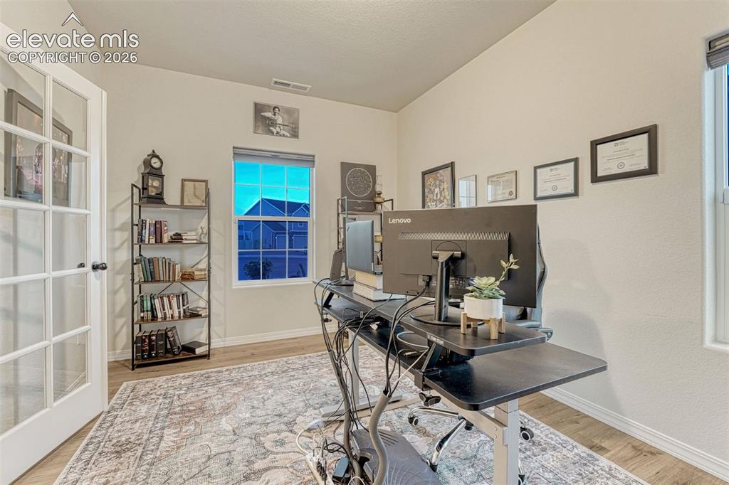 Image 24 of 49: Roomy office located off the entrance foyer
