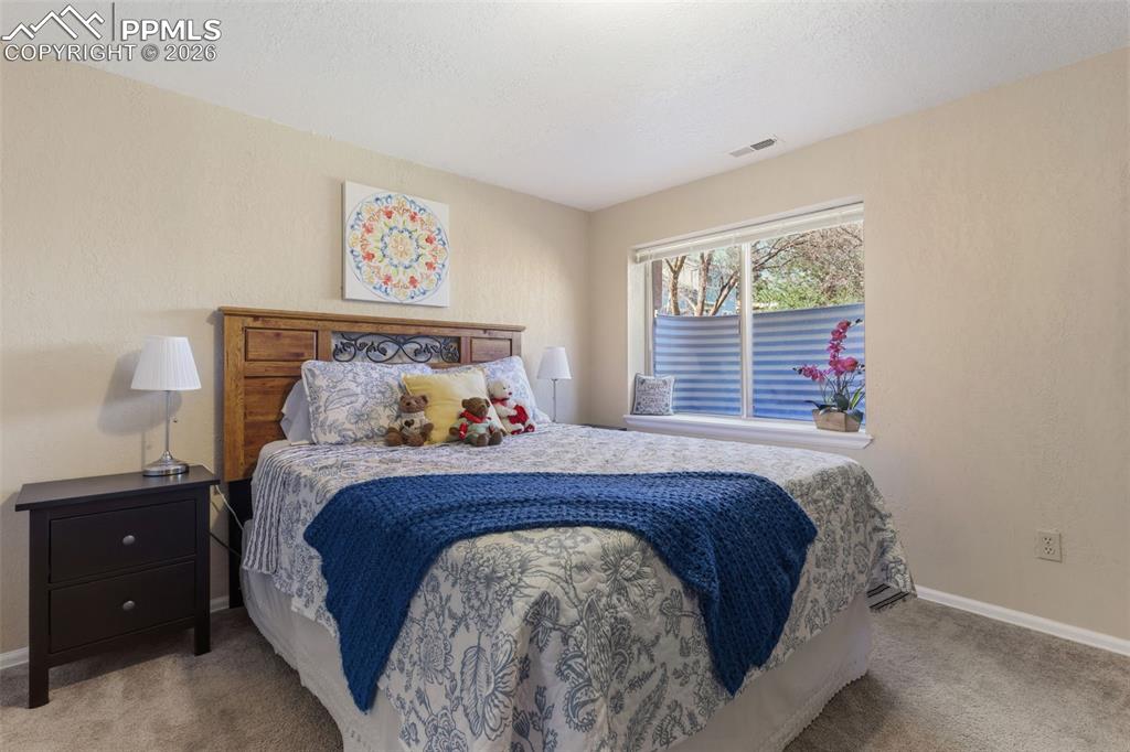 Image 20 of 29: Basement bedroom