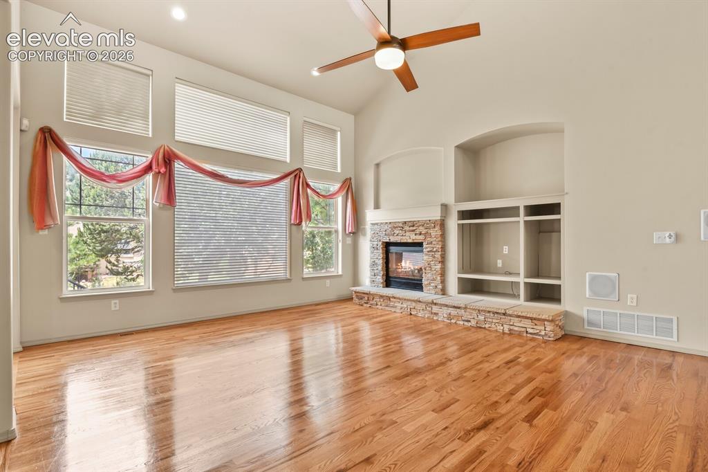 Image 12 of 50: Living room with Built ins and Surround Sound Speakers