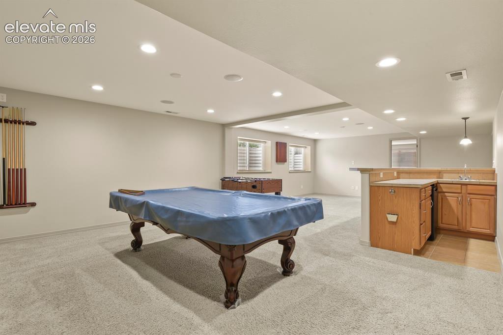 Image 31 of 50: Game Area with Wet Bar