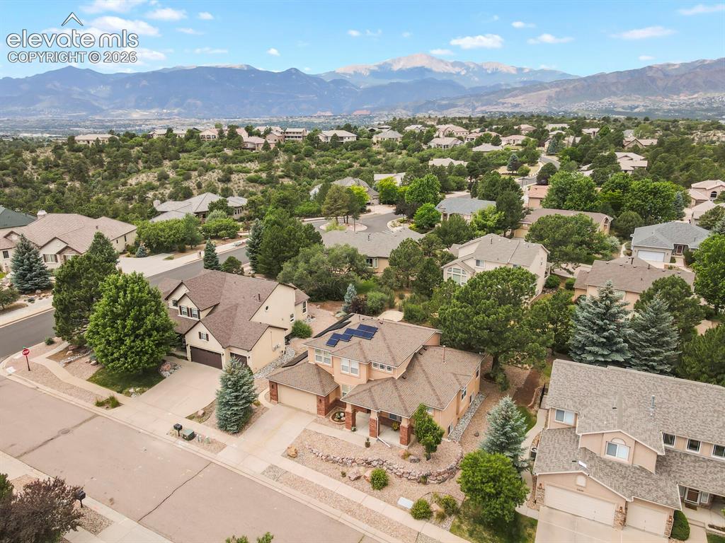 Image 46 of 50: Aerial perspective showcasing a residential neighborhood with distant mount