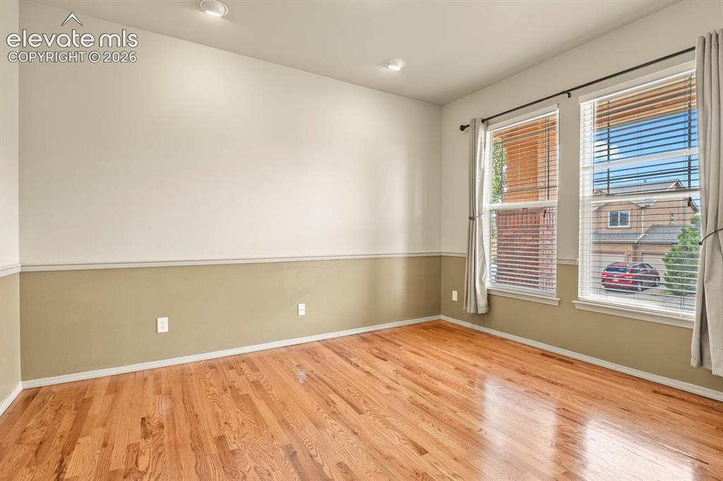 Image 6 of 50: Office or Sitting Room with Hardwood Floors