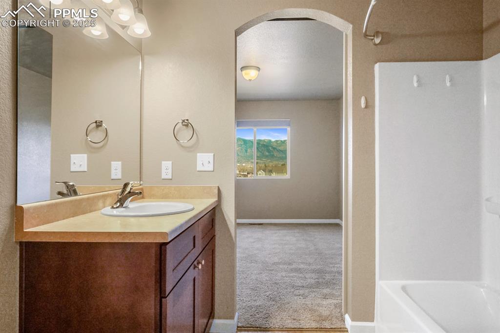Image 15 of 18: Full bath featuring vanity and shower / washtub combination