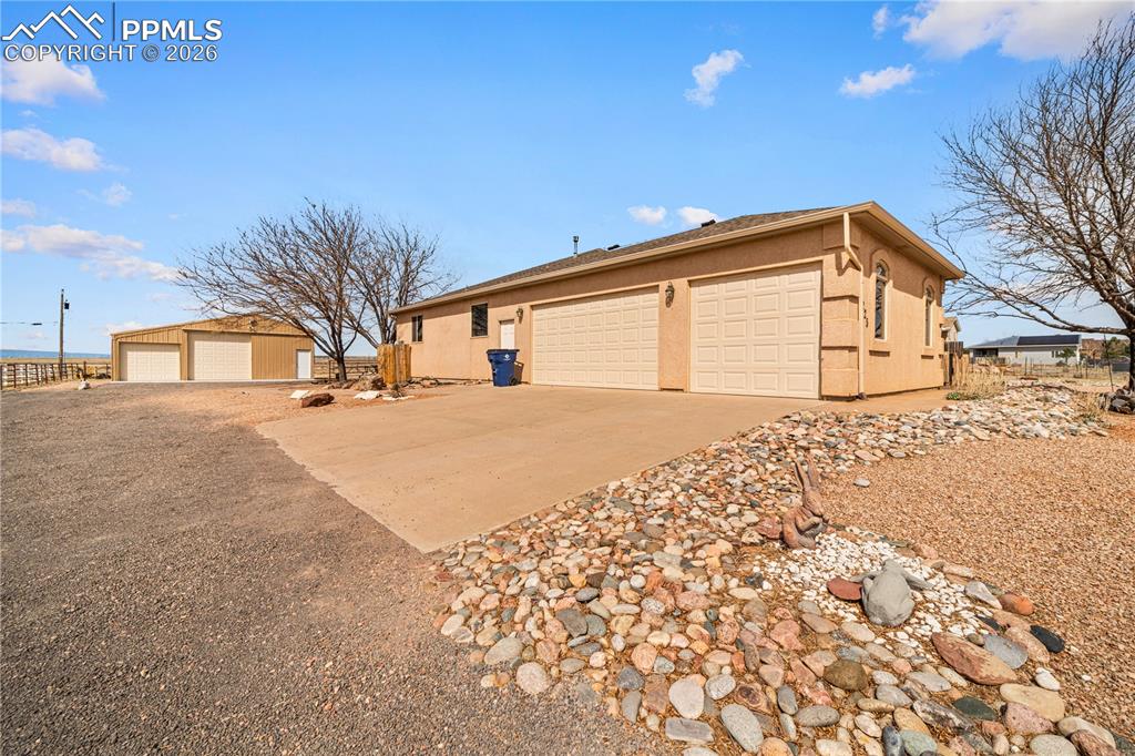 Image 2 of 46: Plenty of parking with large driveway space and 3 car attached garage plus 