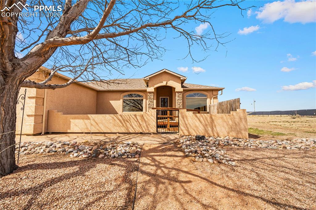 Image 3 of 46: Beautiful setting and low maintenance stucco