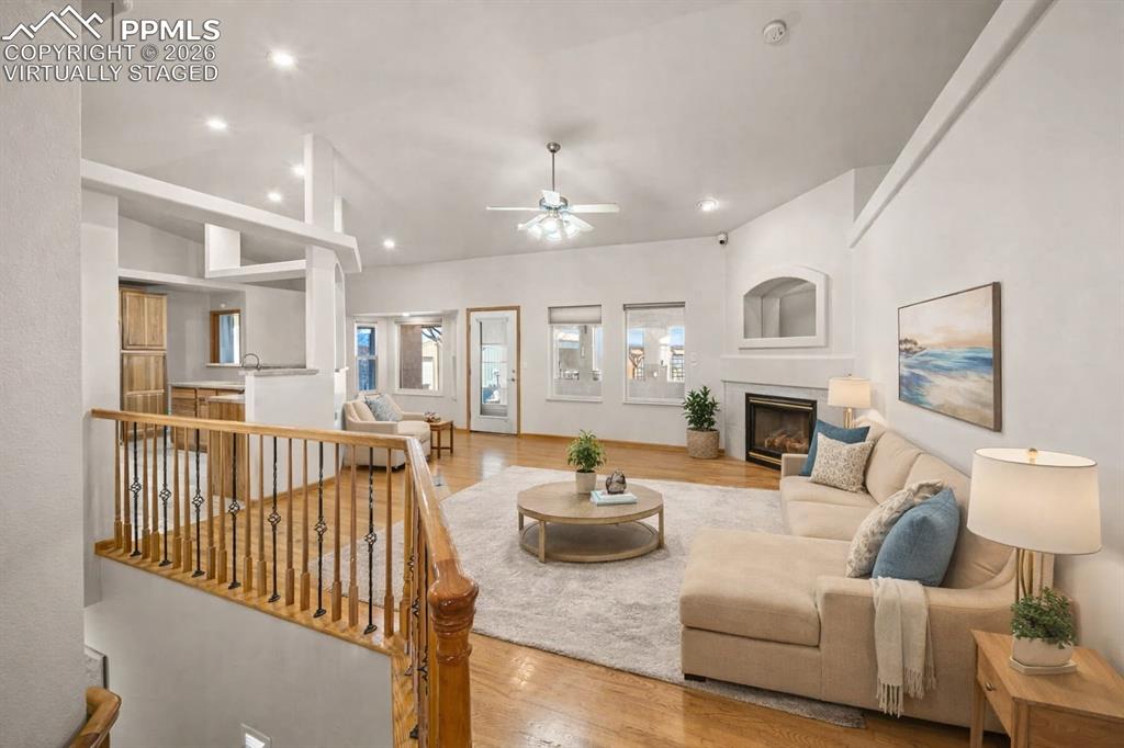 Image 6 of 46: Shown virtually staged main level living room