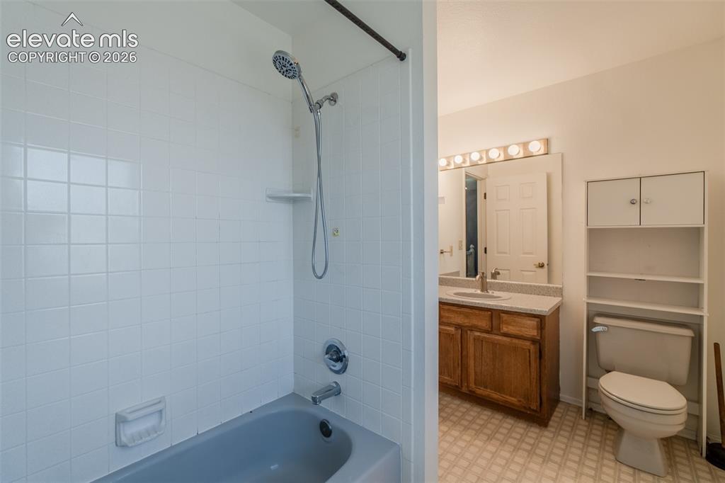 Image 29 of 47: Full hallway bathroom featuring a shower-tub combination with white tile su