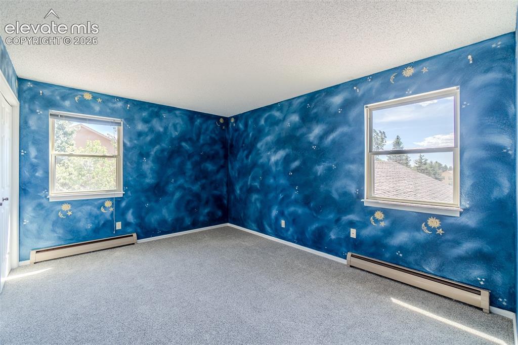 Image 34 of 47: Two of Four upstairs bedroom with new carpet 