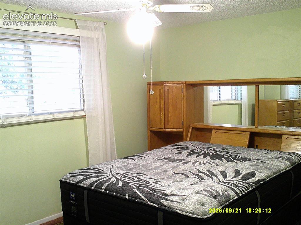 Image 16 of 26: Window with horizontal blinds