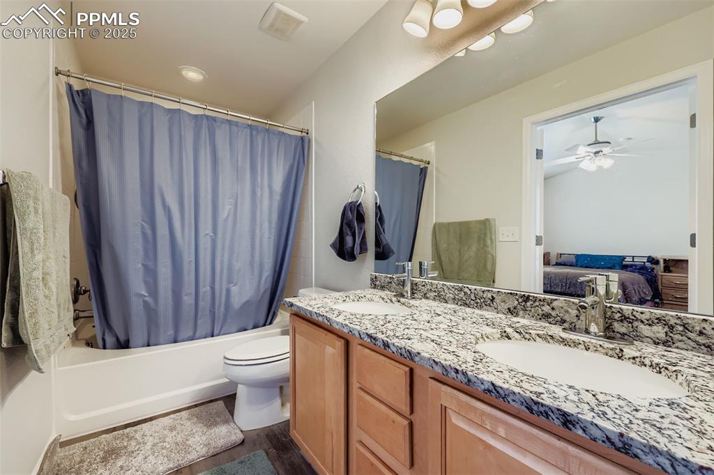 Image 20 of 27: Bathroom with shower / bathtub combination with curtain, ensuite bathroom,